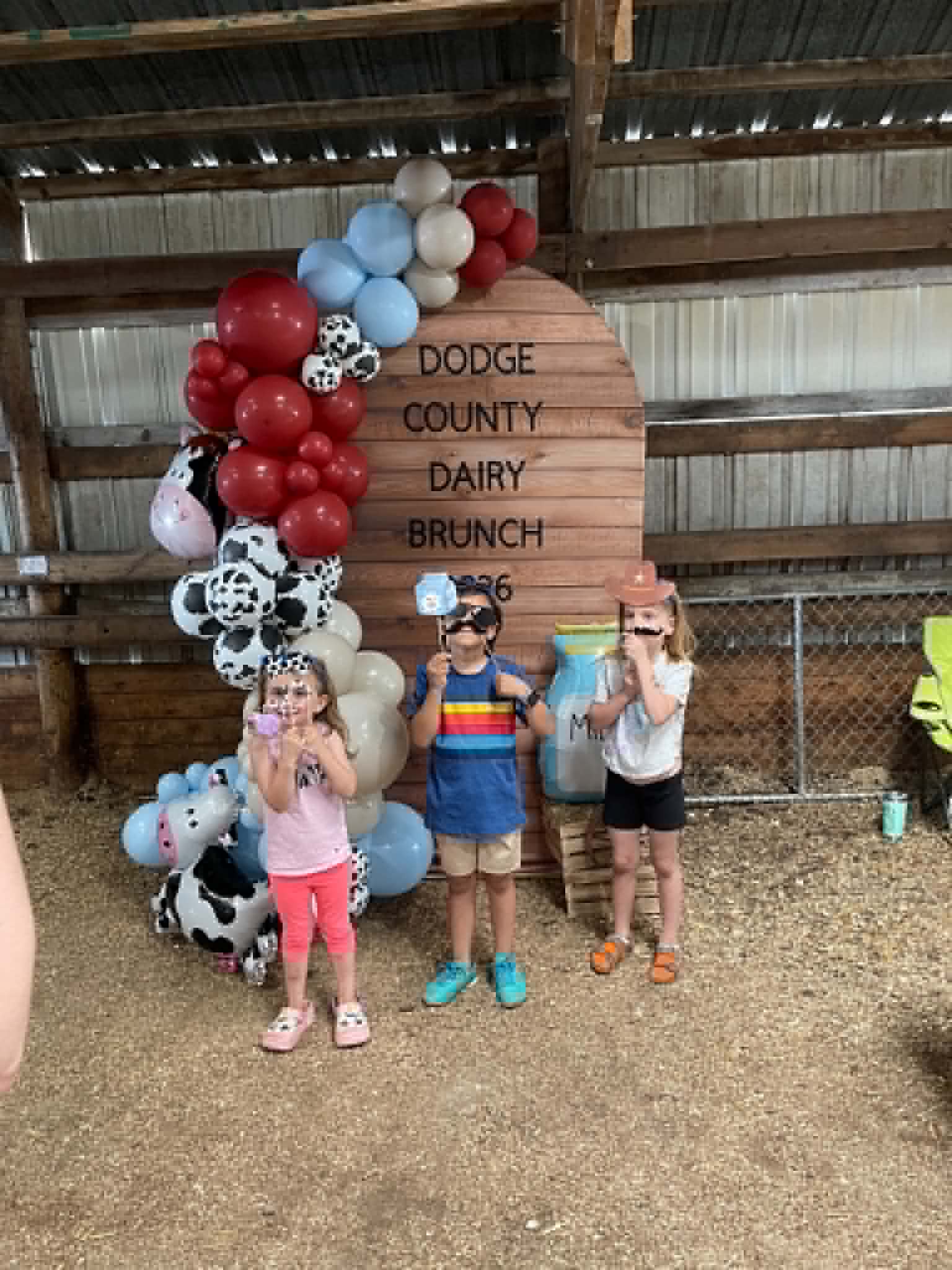 Corrales Designs Dodge County Dairy Brunch booth and balloon display