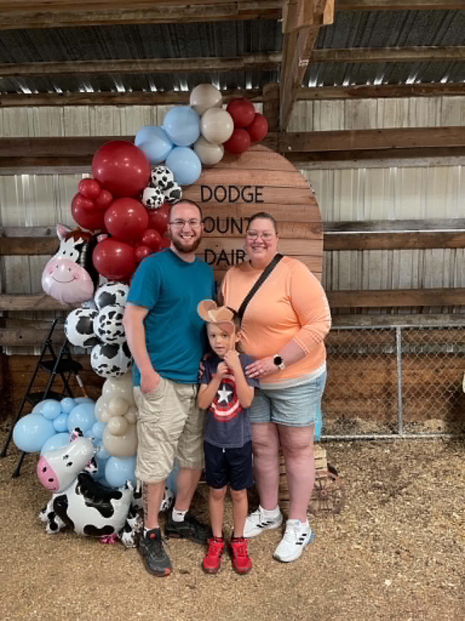 Family photo at the Corrales Designs Dodge County Dairy Brunch balloon display