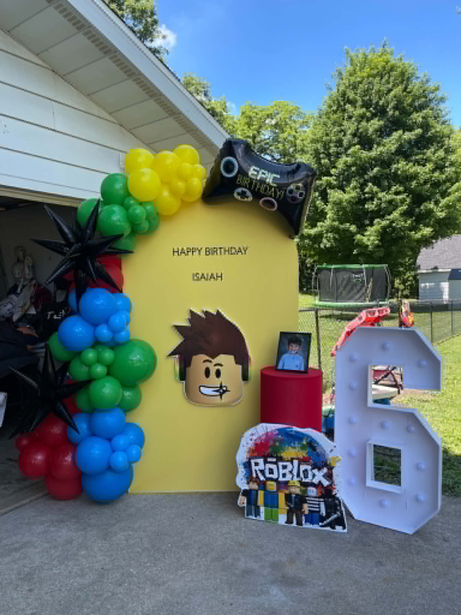 Corrales Designs Roblox themed birthday balloon display with colorful backdrop